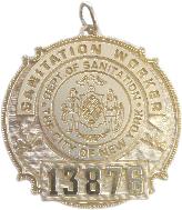 14k yellow gold custom mini-badge jewelry pendant; round badge design of New York NY City Sanitation Department; also available as mini-badge tie tac, lapel pin, cuff links