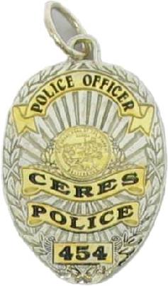 two tone gold plated sterling silver custom mini-badge jewelry pendant; oval shaped badge design of Ceres Police Department; also available as mini-badge tie tac, lapel pin, cuff links